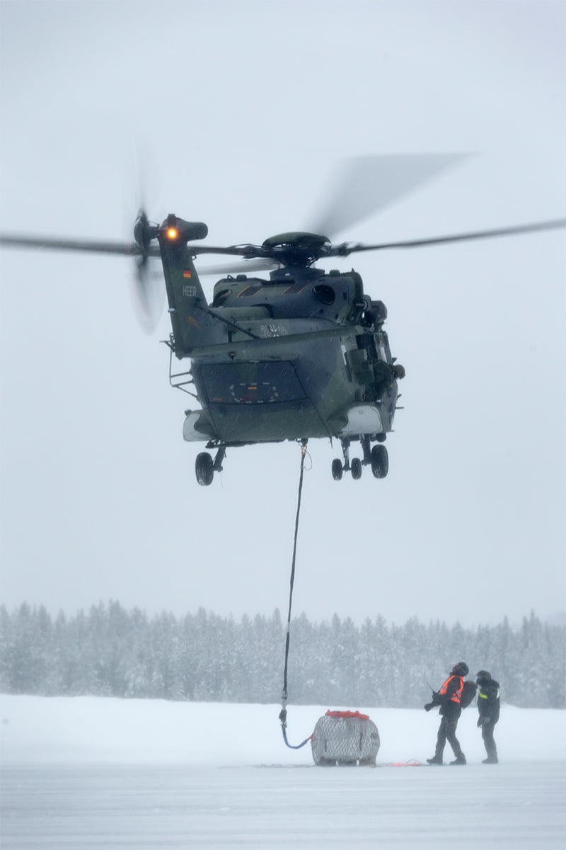 Helicopter with sling load on the ground