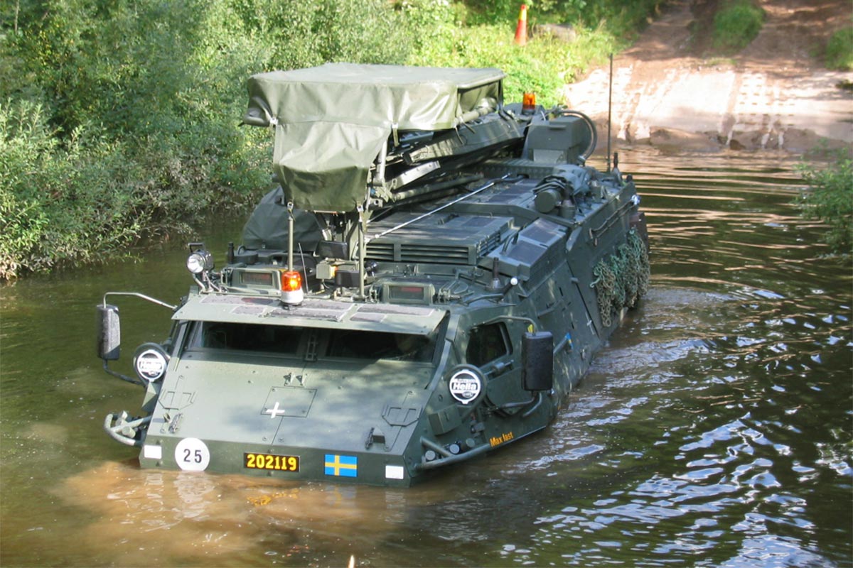 Armoured modular vehicle in fording basin with water half the way up