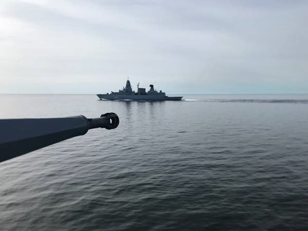 Frigate at sea in the distance